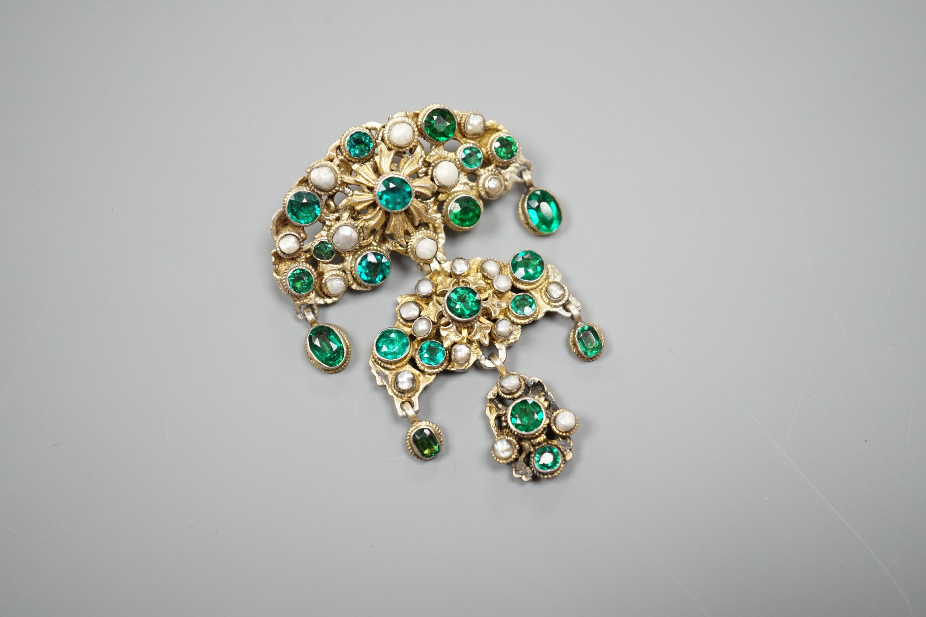 An Austro Hungarian gilt white metal, baroque pearl and green paste set drop pendant brooch, 59mm.